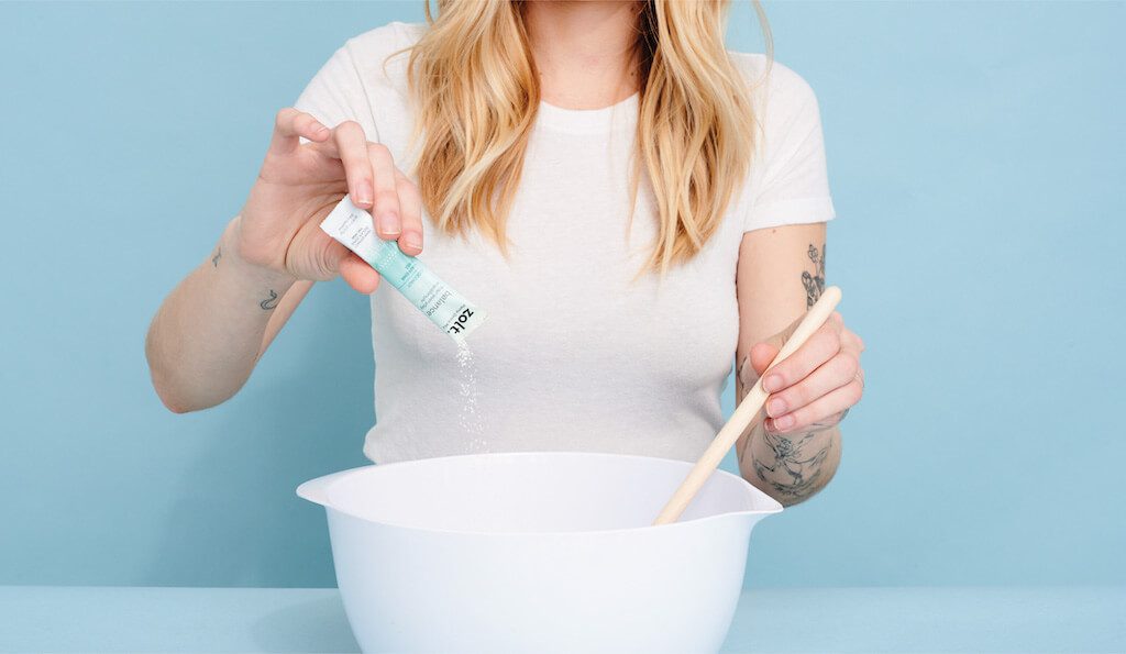 FON_July_Blog_CBDPowder(3) Woman drinking CBD water after doing yoga